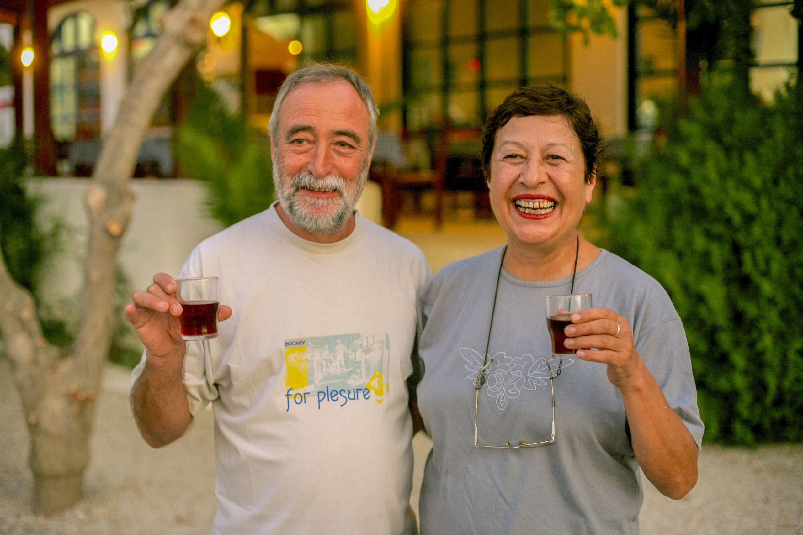 The couple who opened the hotel in 1984, raising a glass together