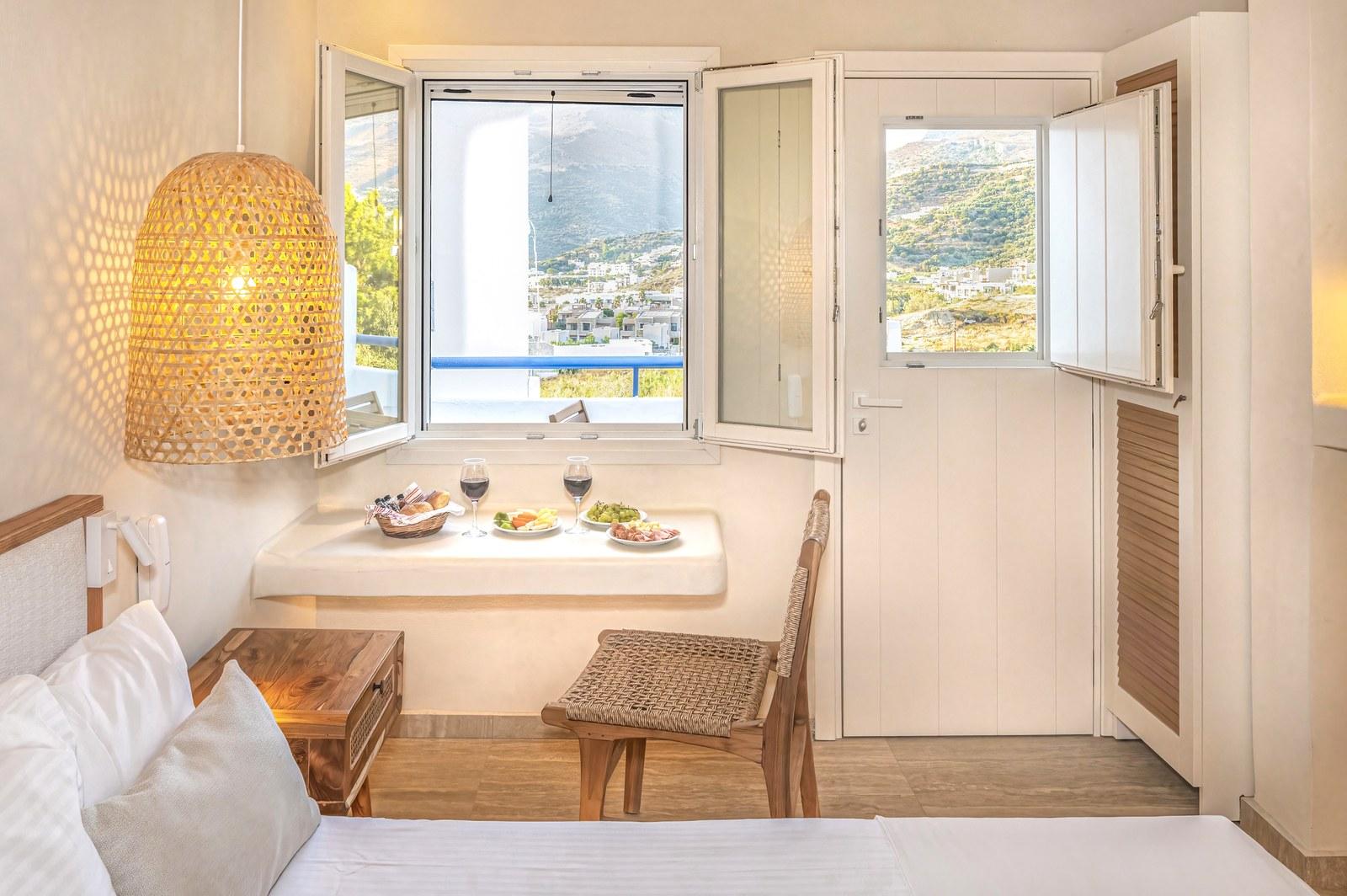 A renovated room at Plakias Bay under its bamboo ceiling