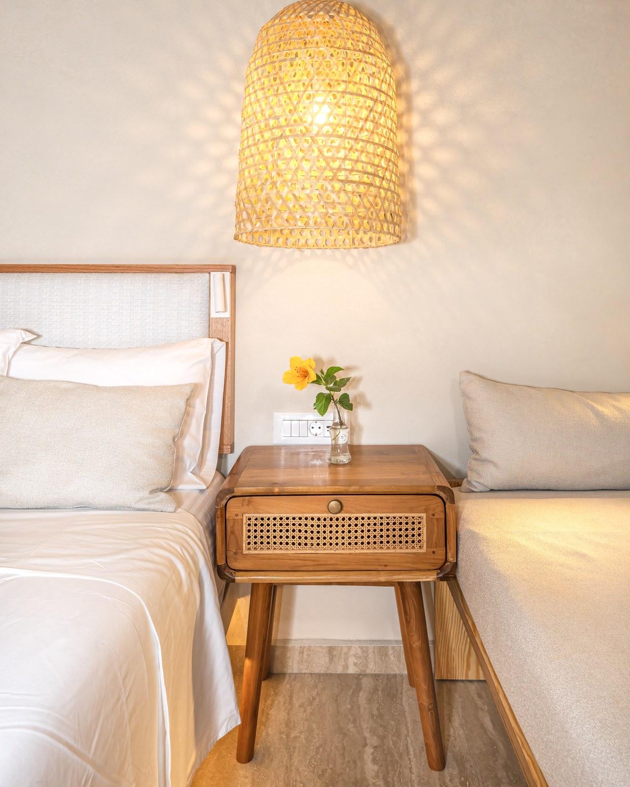 A renovated room at Plakias Bay under its bamboo ceiling