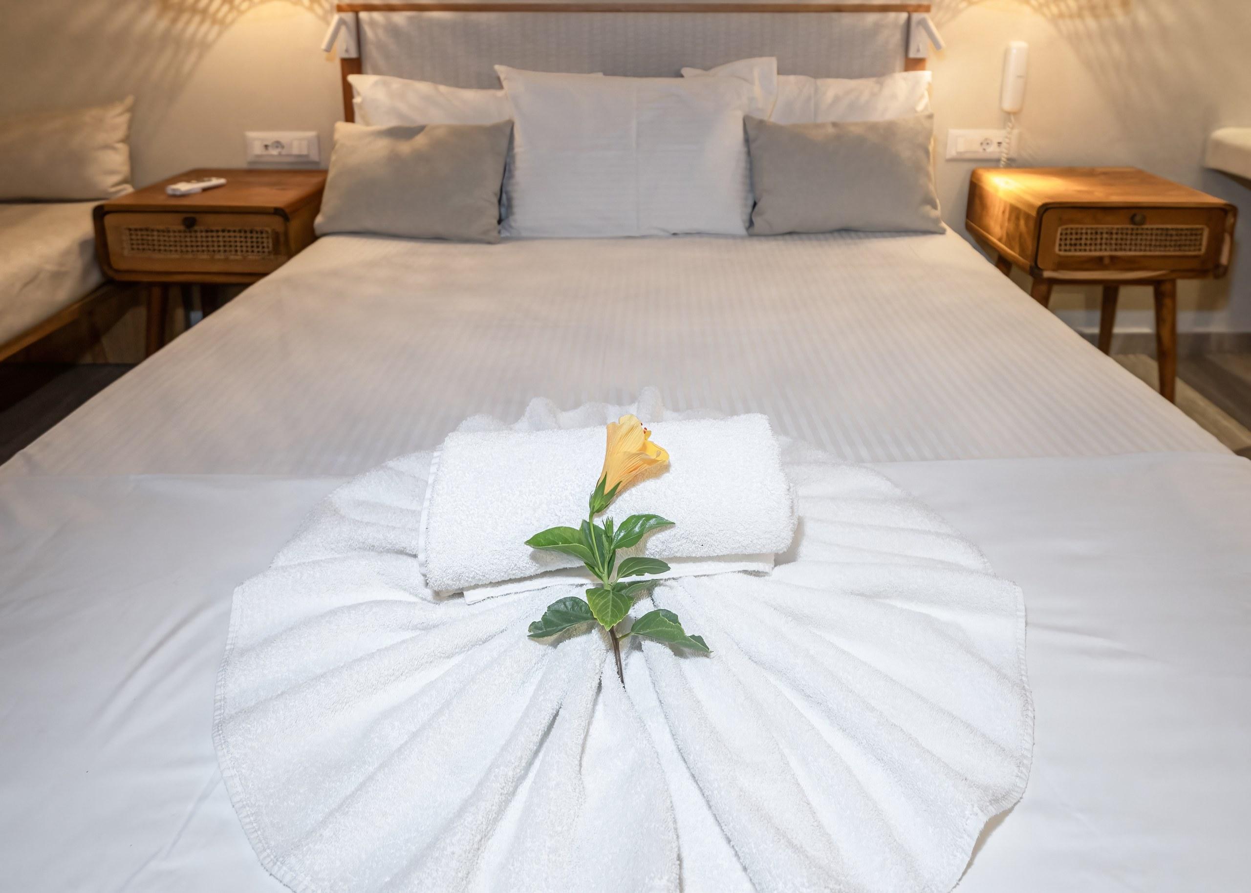A renovated room at Plakias Bay under its bamboo ceiling