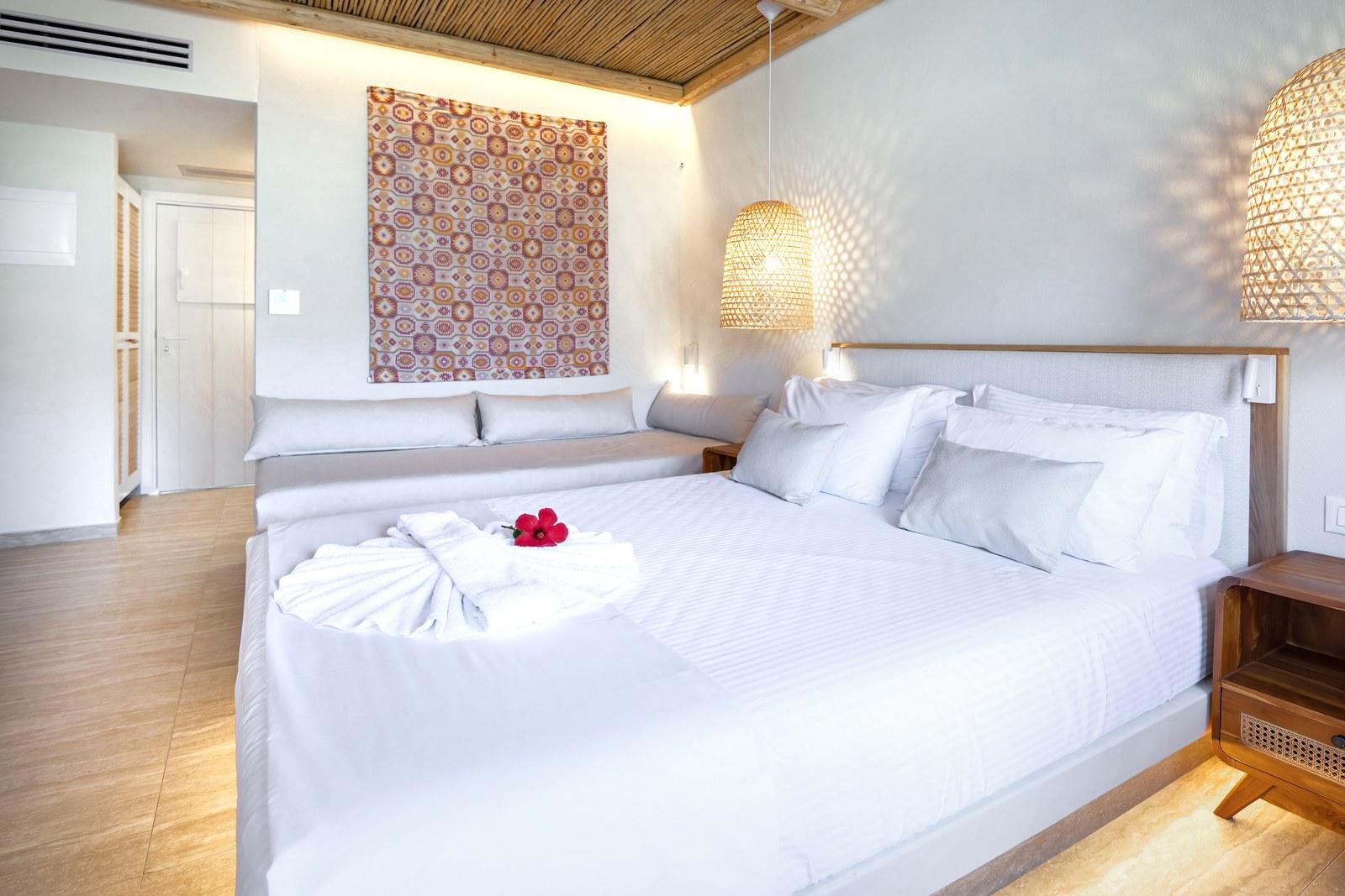 A renovated room at Plakias Bay under its bamboo ceiling