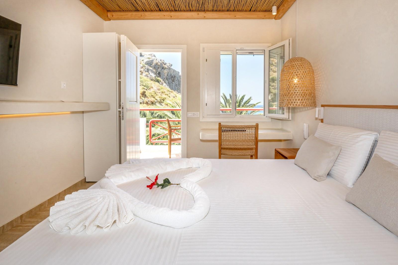 A renovated room at Plakias Bay under its bamboo ceiling